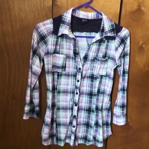 Plaid button down shirt.